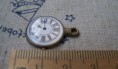 REF. CM00100 COLGANTE RELOJ BRONCE MEDIDA 18 X 23 MM 1,05 EUROS / Unidad